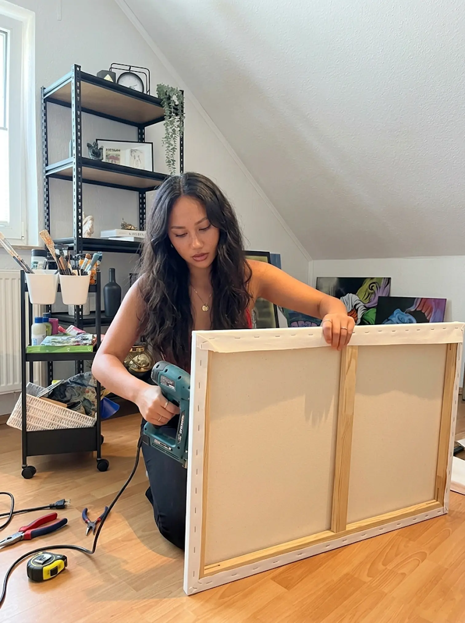Ashley Vong put the canvas on the frame