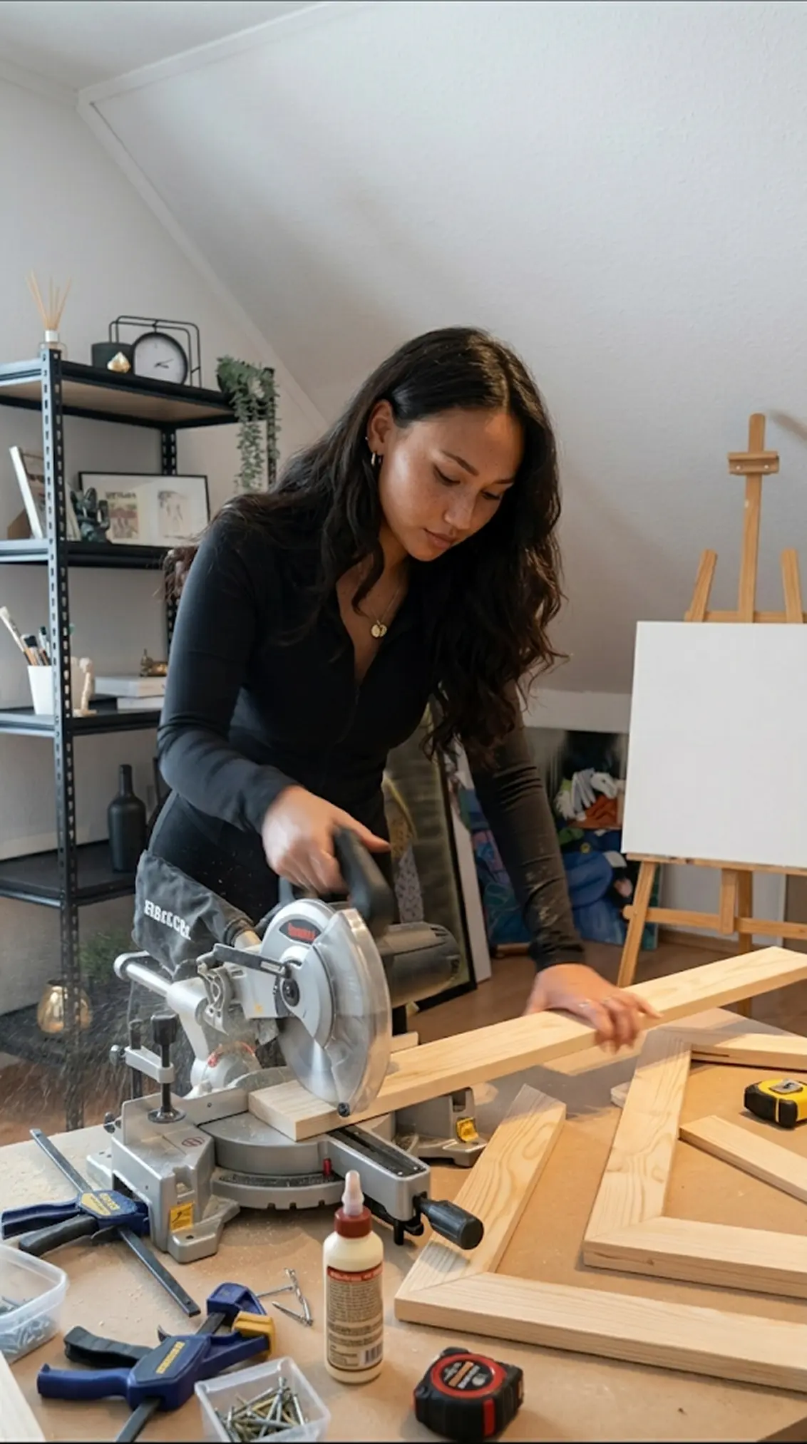 Ashley Vong apply a layer od primier across the canvas